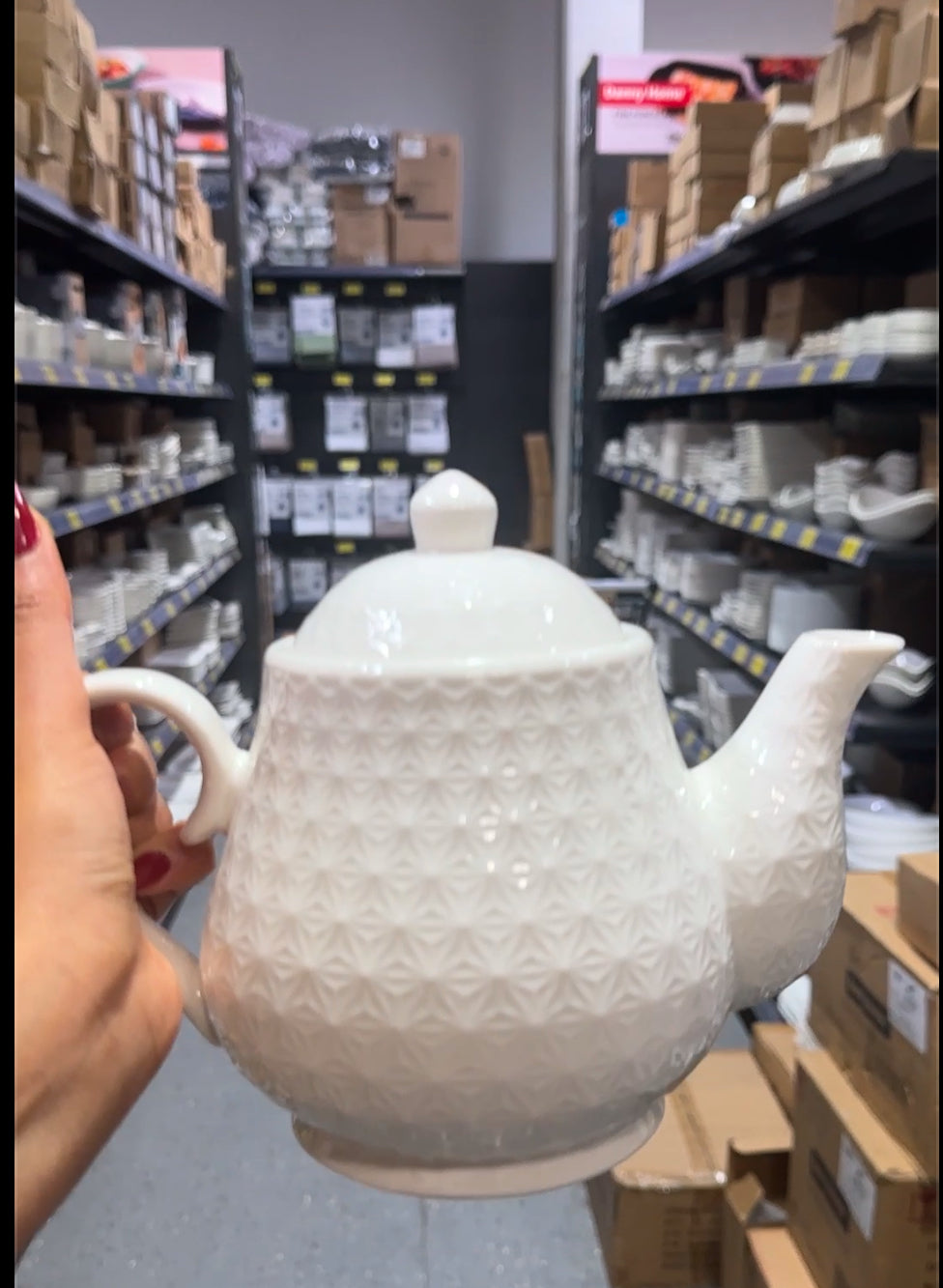 White ceramic teapot with textured diamond pattern and glossy finish, perfect for modern kitchen or tea set collection