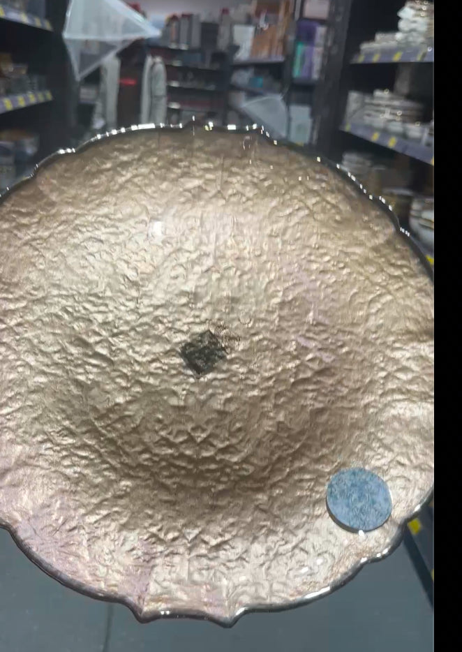 Rustic bronze glass plate with scalloped edges and textured surface.