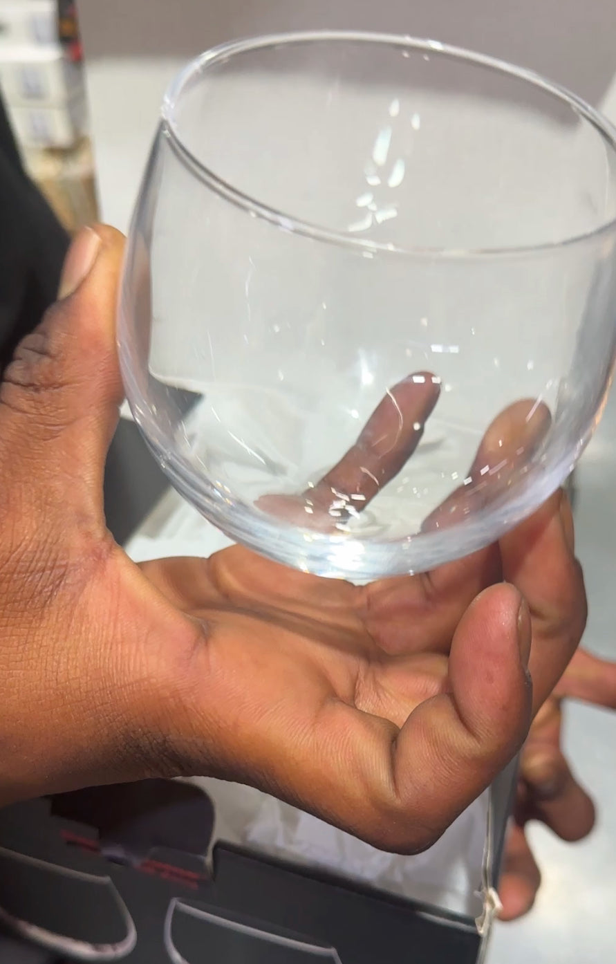 Clear round whiskey glass with smooth curved sides